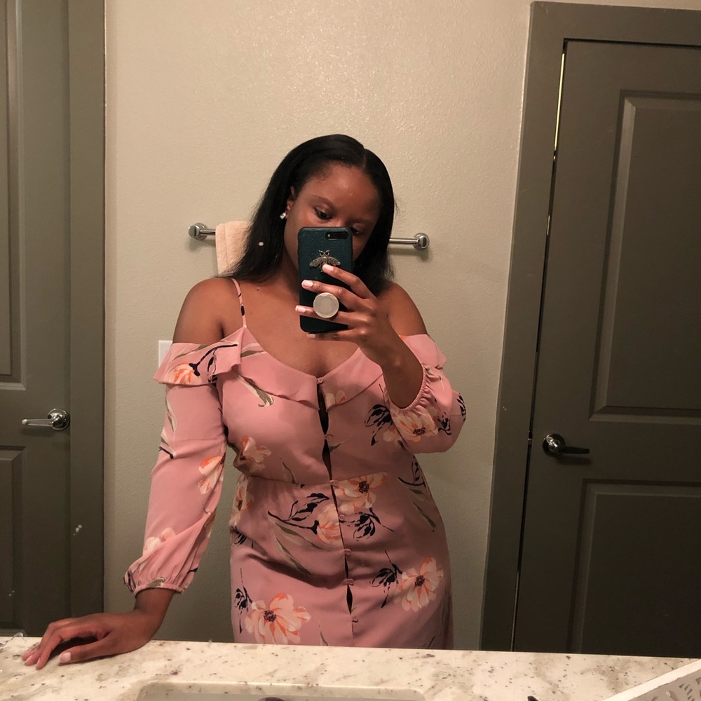 Off the shoulders pink button up dress.